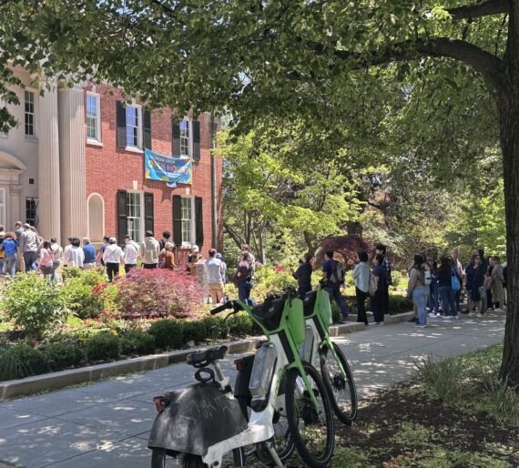 crowd of people, zip bikes by red brick embassy 3003 Massachusetts Avenue.