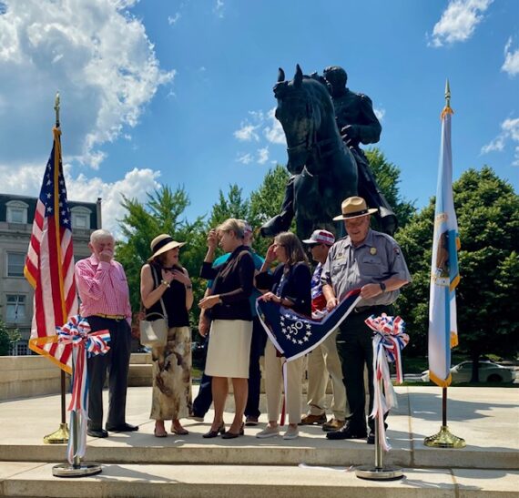 Group gathered for ribbon cutting at restored Sheridan equestrian statue